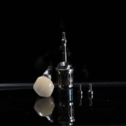 a single dental implant with the abutment and the crown