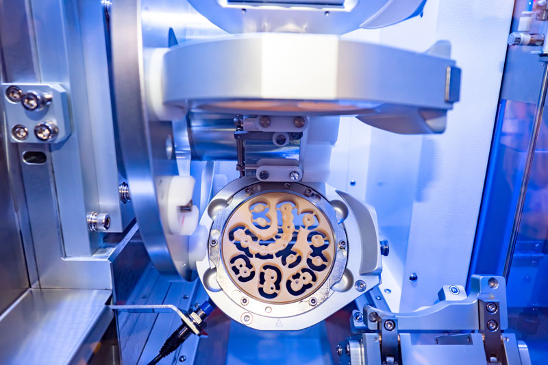 a dental milling machine that makes the zirconia full arches and single dental implants