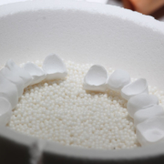 a dental million machine with beads of material near it