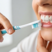 Patient consultation in a dental office about gum health.
