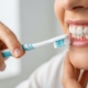 Patient consultation in a dental office about gum health.