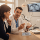 Dentist and patient consultation on dental implants in a modern clinic.