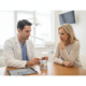 Patient consultation in a dental office discussing implant options
